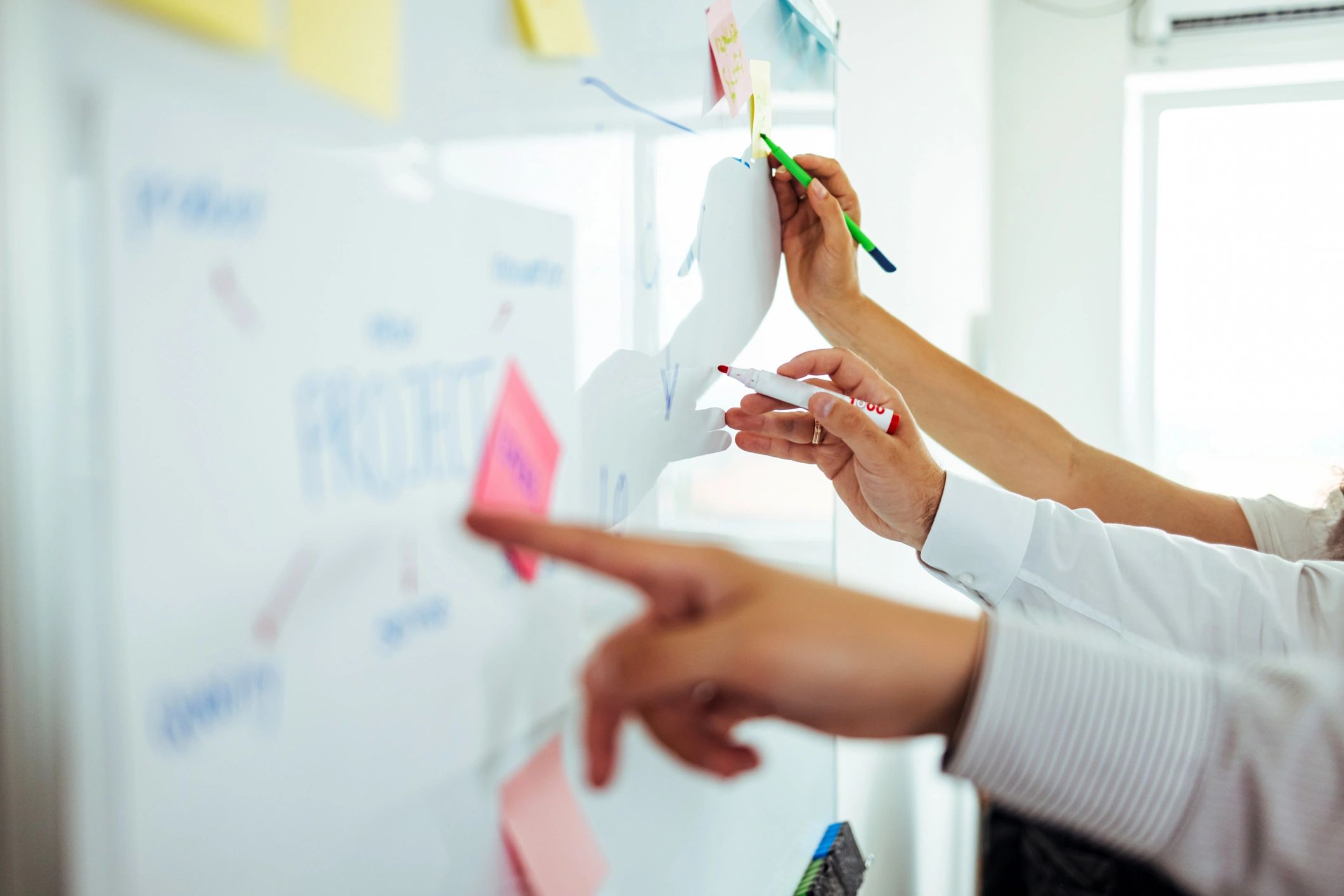 Professional planning digital content on a whiteboard